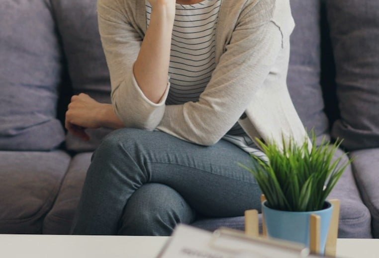 image of a woman sitting down